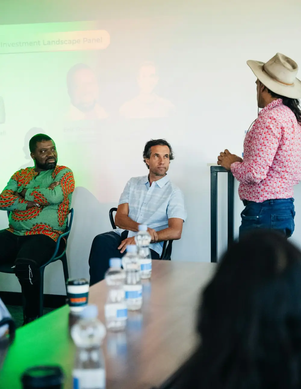 Speakers in a panel discussion around a conference table